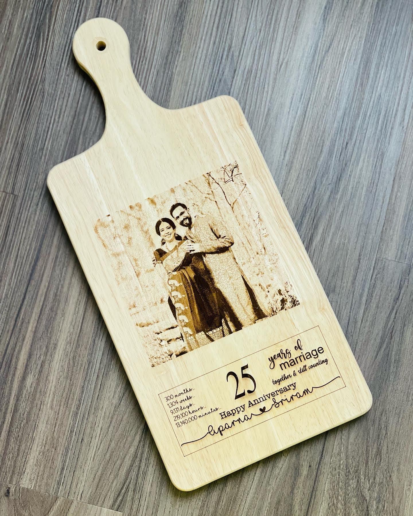 Wedding anniversary gifts cant be more elegant and Cuter than these and an engraved photo is icing on the cake.  These personalized Charcuterie boards are one of our most loved products. The board is made of bamboo wood and is completely safe for indoor use. Impress your guests with these.